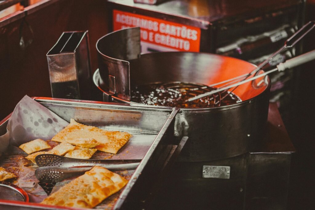 Pastry Next to a Sauce in a Pan