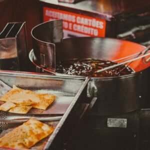 Pastry Next to a Sauce in a Pan