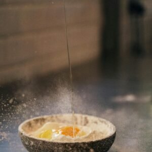 An Egg and Flour on the Bowl